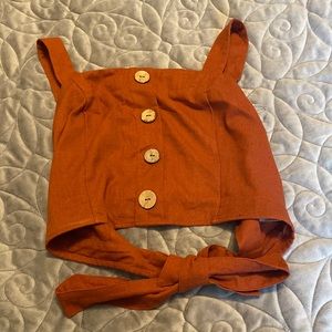 Tie back button front top, Very sexy, back out. NEVER WORN WITH TAGS.